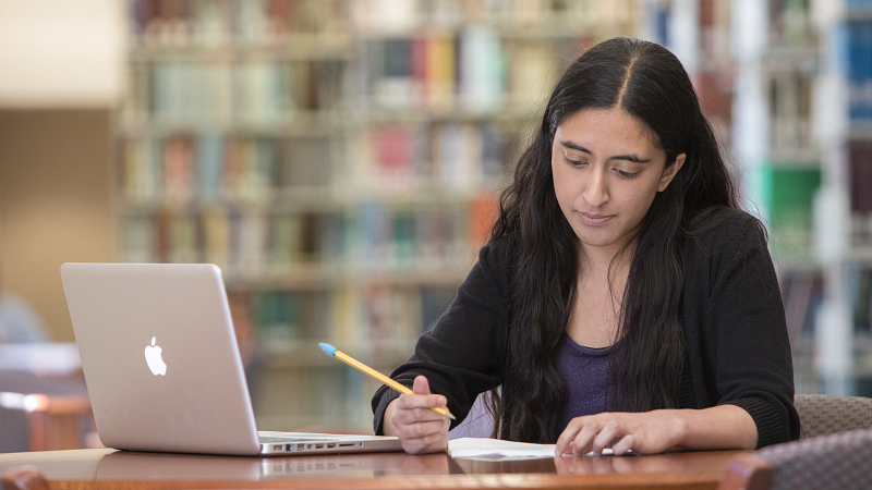 student at the knight library